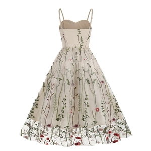 Close-up of floral embroidery on beige mesh layered vintage style A-line dress