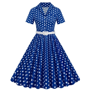 Close-up of vintage navy polka dot dress with lapel collar and matching white belt