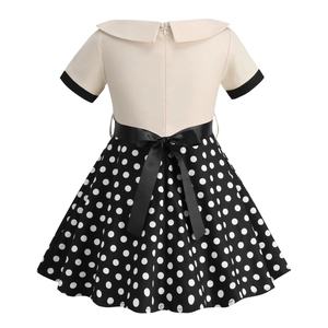 Detail of girls' vintage polka dot dress showing back invisible zipper and satin bow