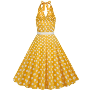 Detail of vintage yellow polka dot halter dress with white waist belt and full flare skirt