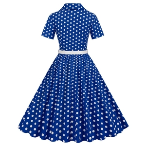 Back view of retro royal blue polka dot dress with white slim belt and A-line skirt