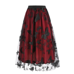 Close-up of black mesh midi skirt featuring red lining and 3D butterfly embroidery