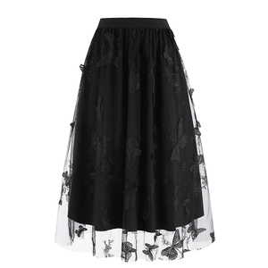Detail of delicate butterfly embroidery on layered black mesh tulle midi skirt