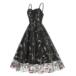 Detailed embroidery of pink floral and green leaves on black mesh overlay dress