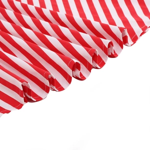 Detailed view of red and white diagonal striped fabric with decorative ruffle hem