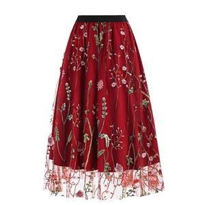 Detailed embroidery of floral patterns on vintage high waist tulle skirt in burgundy