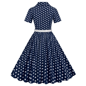 Rear view detail of vintage polka dot dress with A-line silhouette and white waist belt