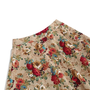 Detailed view of vintage floral print fabric and waistband on A-line midi skirt