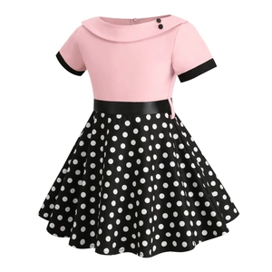 Detail of pink bodice with rounded lapel collar and black waist ribbon on girls' dress