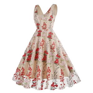 Close-up of red floral embroidery on a vintage 1950s style V-neck sleeveless dress