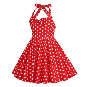 Detailed view of red polka dot girls dress with halter neck and bow decorations