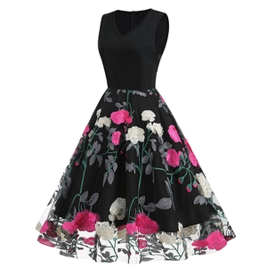 Detailed view of exquisite peony flower embroidery on black mesh tulle vintage dress