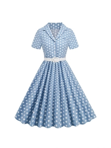Retro light blue polka dot dress with short sleeves and white belt on white background