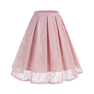 Close-up of the delicate floral lace texture and pleated hem on a pink A-line skirt