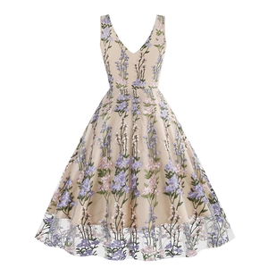 Close-up of intricate floral embroidery on beige tulle V-neck A-line dress details