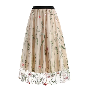 Detail of floral embroidery and tulle texture on A-line skirt with elastic waistband