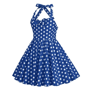 Detailed view of girls' vintage navy blue polka dot dress with halter neck and bow accent
