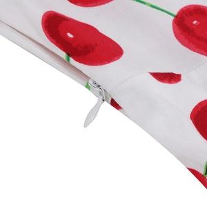 Detailed macro view of high-quality invisible zipper on cherry print floral dress fabric