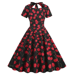 Retro black A-line dress with cherry print featuring short sleeves and bow neckline