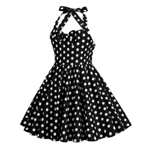 Detail of vintage polka dot dress with halter neck and decorative bow at the neckline