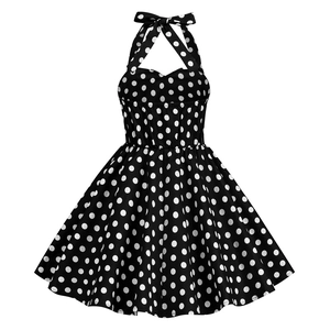 Detail of vintage polka dot dress featuring halter neck, bow accent, and retro A-line cut