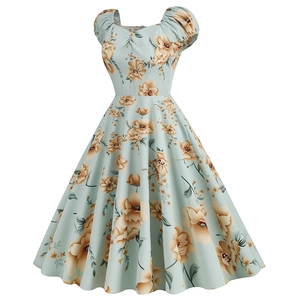 Close-up of vintage floral print dress with puff sleeves and heart-shaped neckline