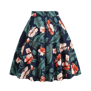 Detail of high-waist A-line skirt with tropical hibiscus floral and palm leaf print