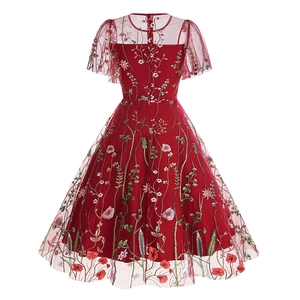 Detailed back view of dark red mesh dress with floral embroidery and ruffled sleeves