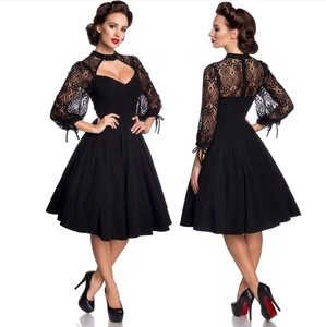 Detailed view of the backless lace bodice and elegant A-line skirt of this black dress