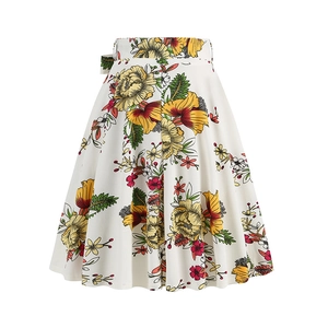 Detail of high-waist A-line skirt with vibrant yellow and red tropical floral prints