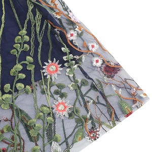 Detail shot of vintage 50s style tulle skirt with floral embroidery and mesh overlay