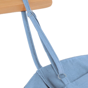 Detail of adjustable metal buckle and strap on light blue 50s vintage polka dot dress