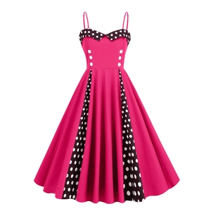 Vintage 50s pink retro swing dress with white polka dots and decorative buttons
