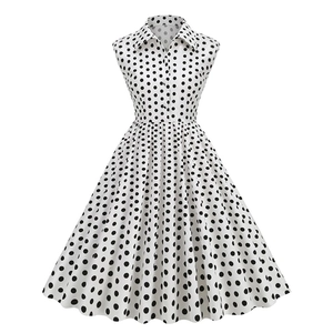 Vintage 1950s polka dot sleeveless A-line cocktail dress with lapel and buttons