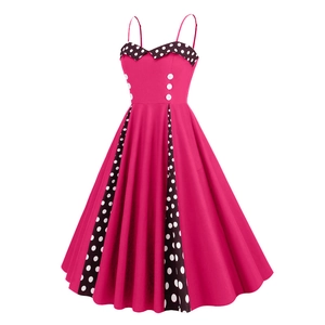 Detail view of pink vintage dress with polka dot collar and decorative white buttons