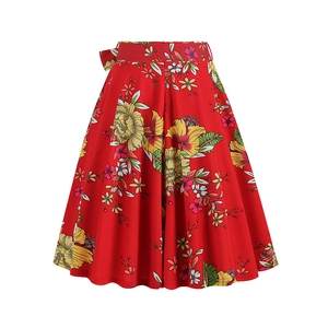 Detailed view of red floral A-line skirt with yellow hibiscus and matching waist belt