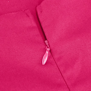 Detail of invisible teardrop zipper on rose pink twill fabric of a 50s vintage dress