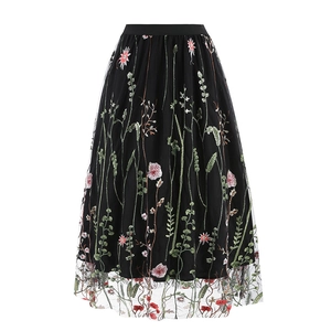 Vintage 50s black mesh midi skirt featuring colorful floral embroidery and elastic waistband