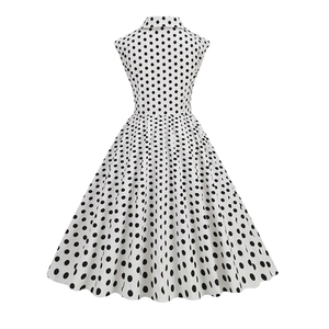 Detailed back view of vintage 1950s polka dot cocktail dress with A-line waist and skirt