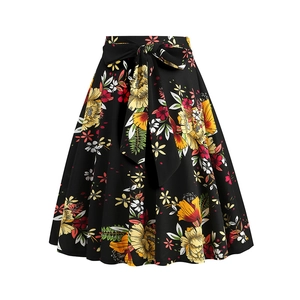 Detail of high waist tie-dye floral skirt with large decorative bow on the waistband