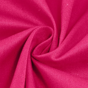 Detailed macro view of magenta woven fabric texture for a vintage 50s style dress