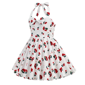 Detail of red cherry print girl's vintage halter dress with a large bow decoration