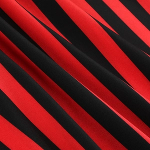 Macro detail of red and black striped vintage pirate skirt fabric with clear texture