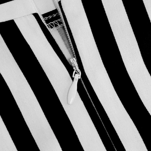 Macro detail of high-quality invisible white zipper on black and white striped skirt