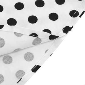 Detailed view of polka dot dress fabric featuring high-quality double stitching finish