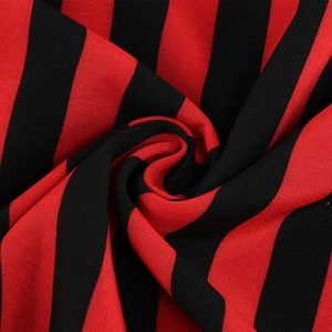 Detail shot of red and black striped vintage fabric with smooth plain weave texture