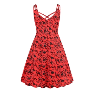 Detail of cross-back straps and pumpkin bat print on festive Halloween dress