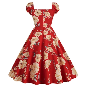 Detail view of red floral vintage Hepburn style dress with classic square neck and puff sleeves