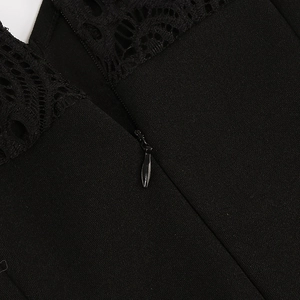 Close-up of the black lace detailing and invisible zipper on the elegant dress back
