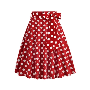 Close-up of a vintage red polka dot midi skirt with a matching tie-up bow waistband